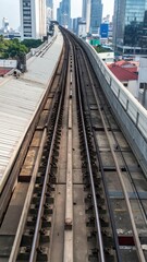 Fototapeta premium Urban Rooftop View of Train Tracks and Subway Line in City Landscape
