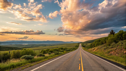 Naklejka premium Long road with a beautiful sunset in the background