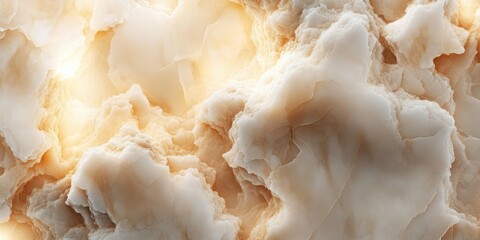 Abstract organic texture.  Soft, flowing forms of pale beige and cream tones resemble clouds or a mineral substance.  Luminous highlights accentuate the sculpted, uneven surfaces
