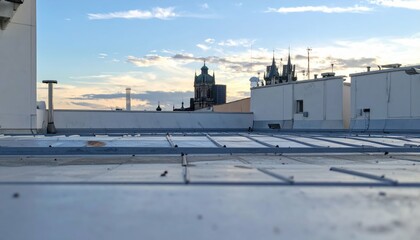 Rooftop View with Background Elements Under Vast Sky at Sunset