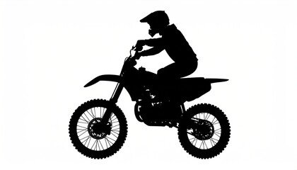 Silhouette of a motocross rider in motion.