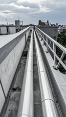 Fototapeta premium Rooftop Perspective with Leading Lines from Pipes and Railings