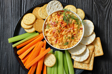 pimento cheese dip served with crackers, veggies