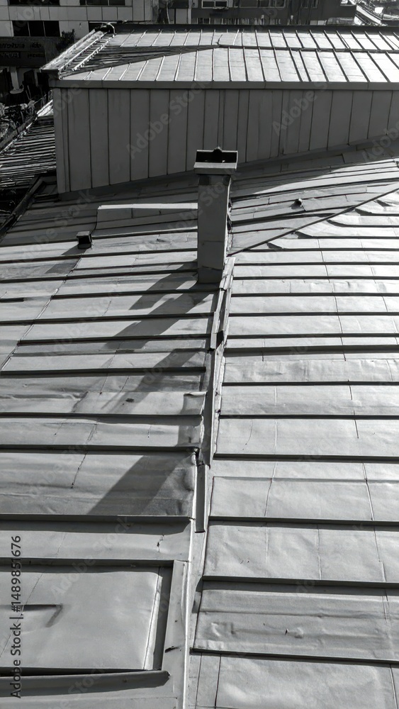 Poster detailed shadows and patterns on a rooftop surface in urban setting