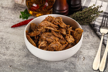 Shredded slow cooked pork meat