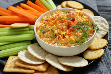 pimento cheese dip served with crackers, veggies