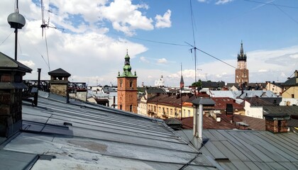 Obraz premium Rooftop View of Historic Architecture Under a Blue Sky