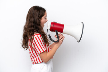 Little girl isolated on white background shouting through a megaphone to announce something in...