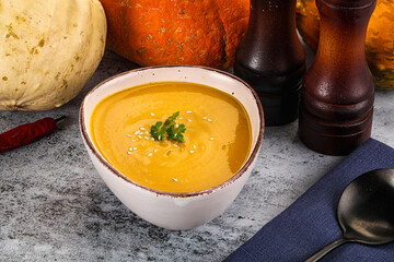 Vegan pumpkin cream soup served sesam