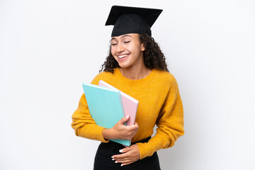 Arab university graduate woman holding books isolated on white background smiling a lot