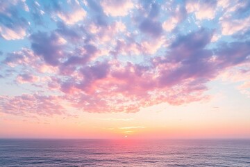 Fototapeta premium Sunsets pastel hues over tranquil ocean vista