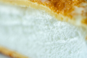 Slice of omelette poulard with pancakes on a light background. close-up