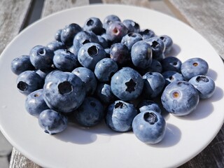 Cosmic blue shades of garden blueberries. An irreplaceable and healthy breakfast. Food for a good...