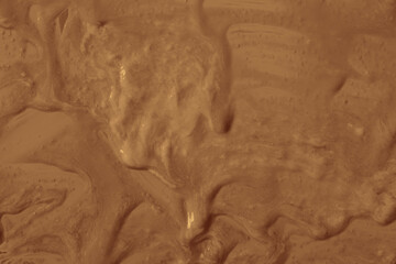 Brown paint splashes cover the surface. The paint is thick and has a glossy texture, which gives it...