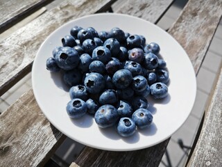 A healthy breakfast. Dark blue berries. Nature's gifts for human health.