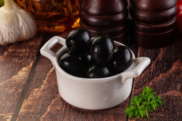 Mediterranean marinated Black olives in the bowl