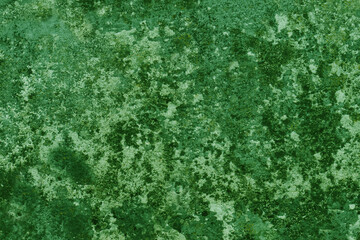 Abstract background of green damaged wall.