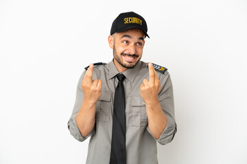 Young security  caucasian man isolated on white background with fingers crossing