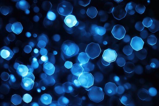 Abstract bokeh effect, vibrant blue light patterns on a dark background