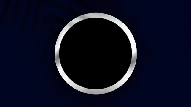 Simple animated silver or metallic circular frame. Clean modern design with subtle light movement on a solid dark blue background