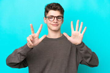Teenager Russian man isolated on blue background counting eight with fingers