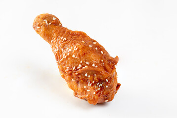 Fried chicken with Korean sauce on white background.See less