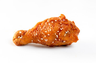 Fried chicken with Korean sauce on white background.See less