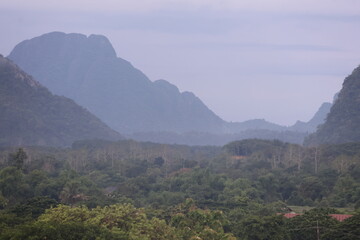 mountain landscape with fog and clouds in Vang Vieng Laos