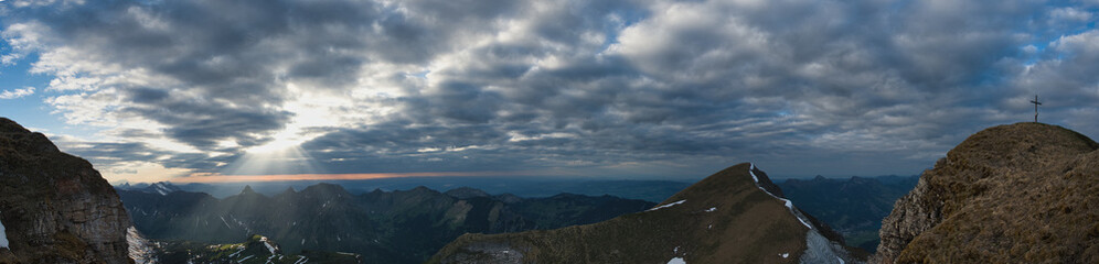 large panorama of the Wiggis mountain with mountains, Lake Zurich, Lake Greifensee and Lake Pfäffikersee in the evening with clouds