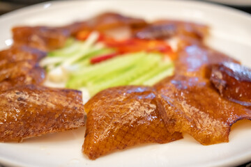 Deep fried Peking duck skin, served on plate