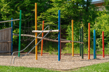 Fototapeta premium Colorful Playground with Slide in a Sunny Park