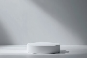 Fototapeta premium Single white pedestal in empty room, sunbeams