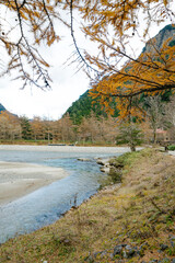 landscape view of japan alps mountain with natural forest, blue river on autumn season at kamikochi Nagano.