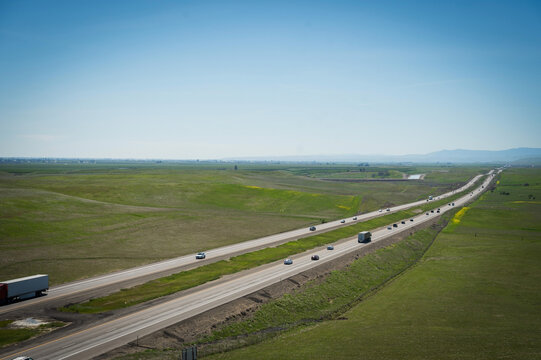 The Interstate Five, I-5, Highway through farmland in Northern California, USA.