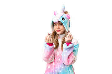 Young girl with unicorn pajamas over isolated chroma key background making money gesture