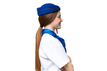 Airplane stewardess over isolated chroma key background in lateral position