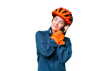 Young cyclist woman over isolated chroma key background making sleep gesture in dorable expression