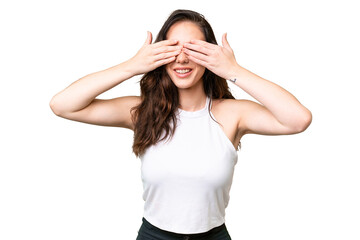 Young caucasian woman isolated over isolated background covering eyes by hands