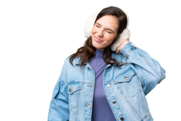 Young caucasian woman wearing winter muffs over isolated background with neckache