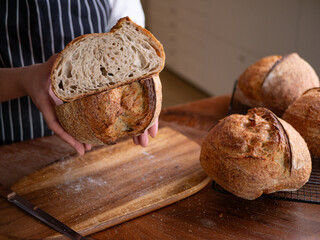 Baker’s Hand Presenting Homemade Sourdough.