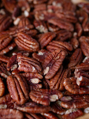 raw organic pecan nuts pattern background.