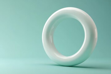 Abstract minimalist ring form on a mint backdrop.