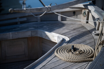 Nautical ropes on a wooden deck. Boat detail