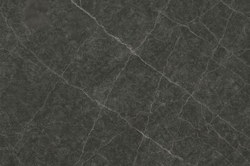 Fototapeta premium A close-up of dark grey marble with soft white veins that provide a striking contrast against the dark surface.