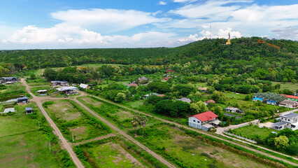 Buriram's Pride. Phra Suphattharabophit and the Stunning Landscape of Khao Kradong, buddha statue in thailand.