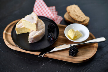 Delicious soft cheese on the plate
