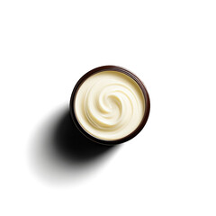 Overhead shot captures swirl of white cream in jar with dark background and soft diffused lighting.