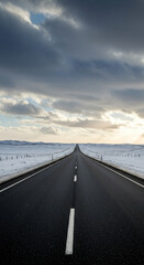Fototapeta premium Straight highway road through winter landscape