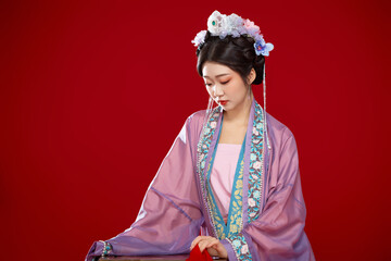 Beautiful woman wearing Chinese Ming Dynasty Hanfu with hairpin and flower ornaments on red...