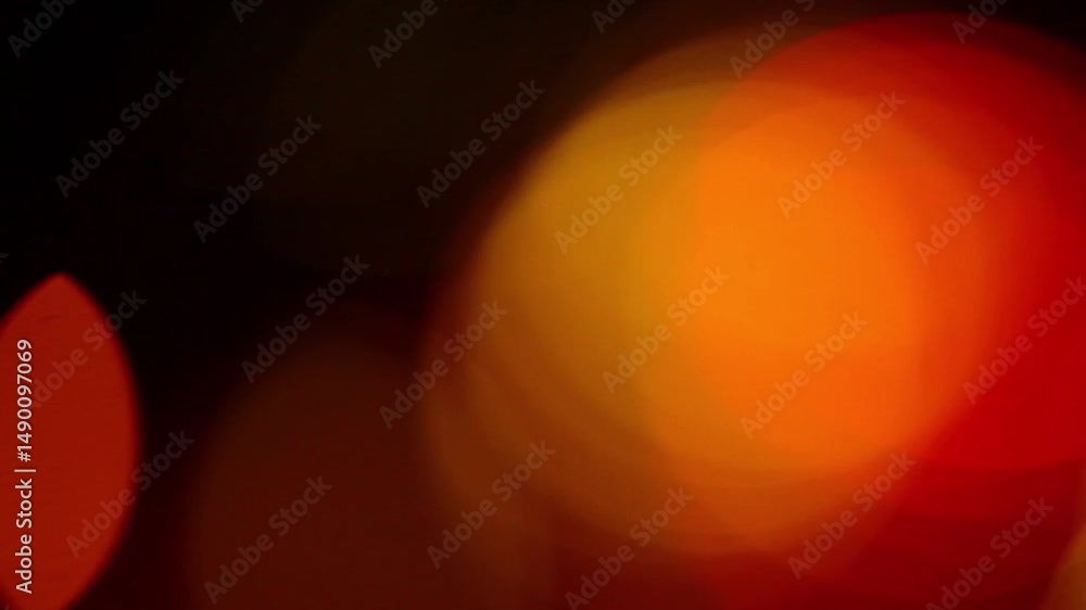 Poster abstract light orbs with red and orange bokeh effect captured in low light photography